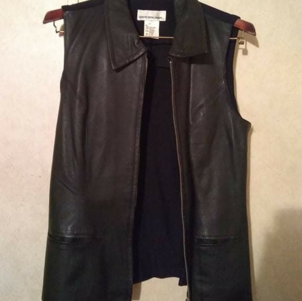 100% leather vest w/spandex back